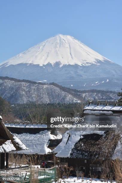 mt fuji and traditional houses - kamal zharif stock pictures, royalty-free photos & images