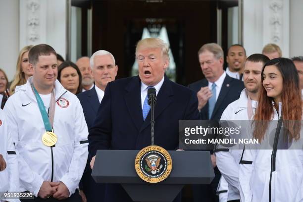 President Donald Trump speaks during an event honoring the US Olympic team in the North Portico of the White House on April 27, 2018 in Washington,...