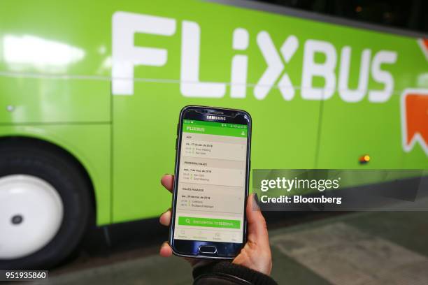 The FlixBus app is displayed on a Samsung Electronics Co. Smartphone in this arranged photograaph at Munich central bus station in Munich, Germany,...