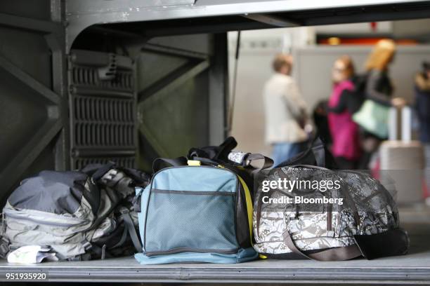 Bags sit in the luggage hold of a FlixBus passenger bus at Munich central bus station in Munich, Germany, on Friday, April 27, 2018. Since...