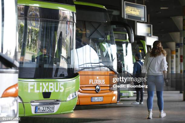 FlixBus passenger buses stand at Munich central bus station in Munich, Germany, on Friday, April 27, 2018. Since introducing a handful of routes in...