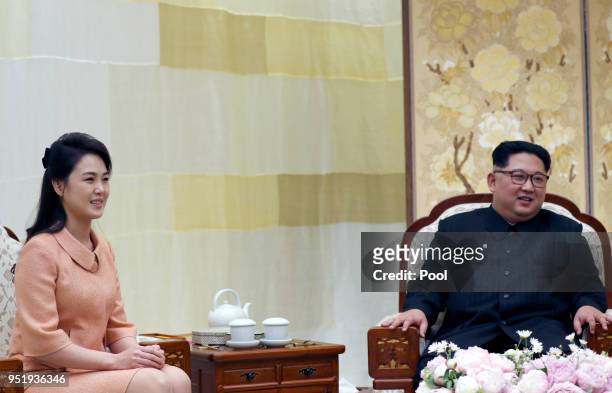 North Korean first lady Ri Sol-ju and Leader Kim Jong Un upon Ri's arrival at the Peace House on April 27, 2018 in Panmunjom, South Korea. Kim and...
