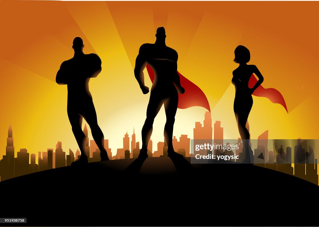 Vector Trio Superhero Team Silhouette with City skyline in the Background