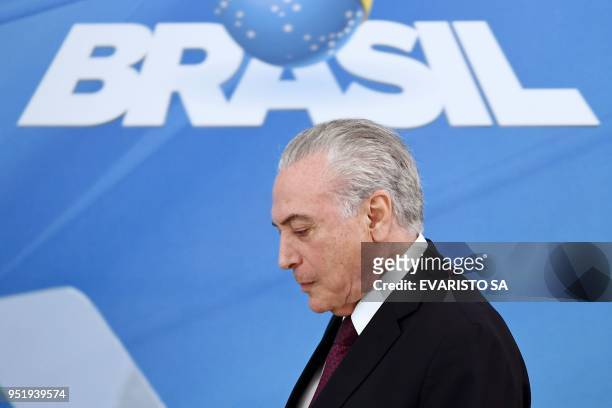 Brazilian President Michel Temer arrives to give a statement to defend himself and his family from allegations of corruption, at Planalto Palace in...