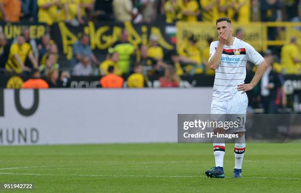 Dominik Kohr of Leverkusen looks dejected during the Bundesliga match between Borussia Dortmund and Bayer 04 Leverkusen at Signal Iduna Park on April...