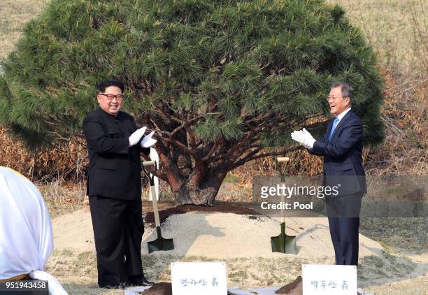 North Korean leader Kim Jong Un and South Korean President Moon Jae-in attend the tree planting ceremony during the Inter-Korean Summit on April 27,...