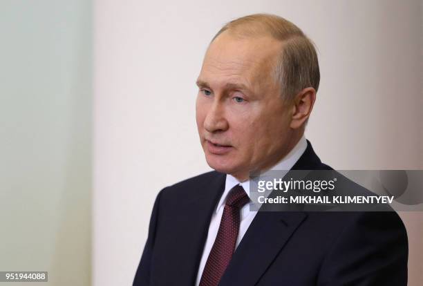 Russian President Vladimir Putin attends a meeting with members of the Legislator Council under the Russian Federal Assembly, on the occasion of...