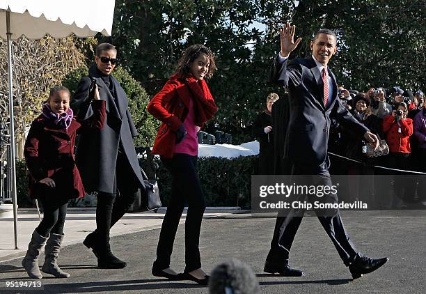 President Barack Obama, first lady Michelle Obama and their children Sasha and Malia leave the White House December 24, 2009 in Washington, DC. The...