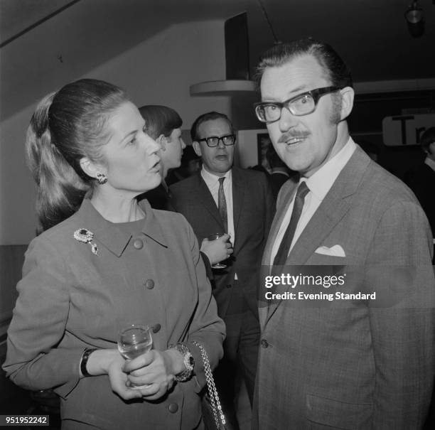 British socialite Olga Deterding and British journalist and television presenter and broadcaster Alan Whicker , UK, 29th May 1968.