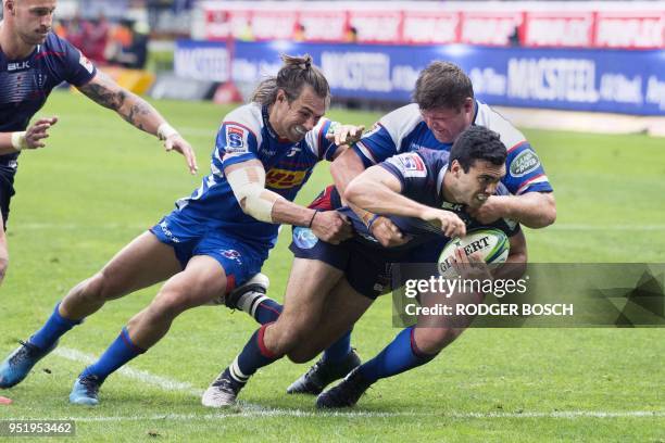 Rebels' Jack Debreczeni is tackled by Stormers' Johannes Engelbrecht during the Super Rugby rugby union match between South Africa's Stormers and...