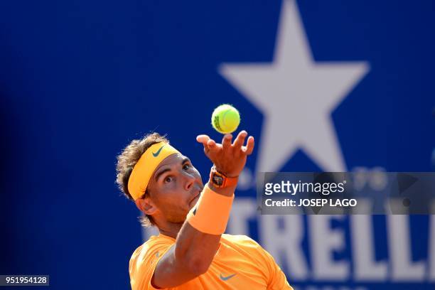 Spain's Rafael Nadal serves to Slovakia's Martin Klizan during their Barcelona Open ATP tournament quarter-final tennis match in Barcelona on April...