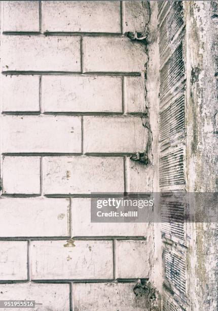 Texture of the facade of the old house. Wooden window. Background