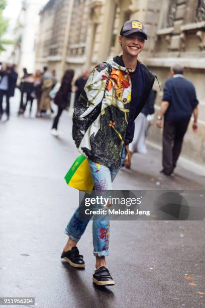 Model Sasha Pivovarova wears a floral-print jacket and floral jeans after the Proenza Schouler show on July 02, 2017 in Paris, France.