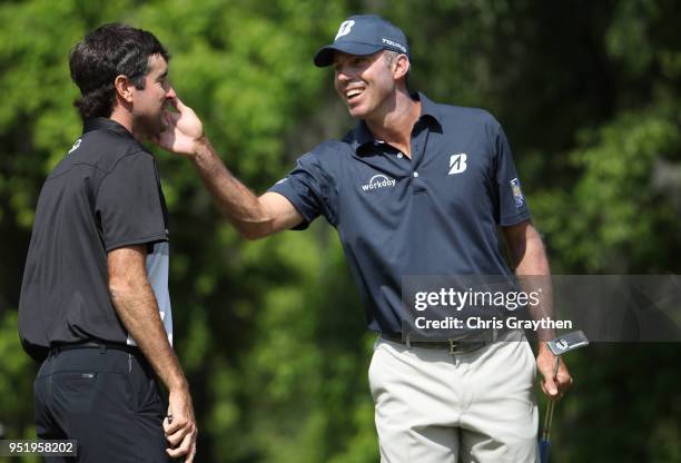 Matt Kuchar reacts to their birdie putt with Bubba Watson on the 15th hole during the second round of the Zurich Classic at TPC Louisiana on April...