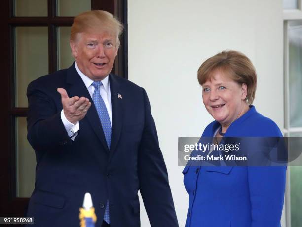 President Donald Trump welcomes German Chancellor Angela Merkel at the West Wing of the White House on April 27, 2018 in Washington, DC. President...