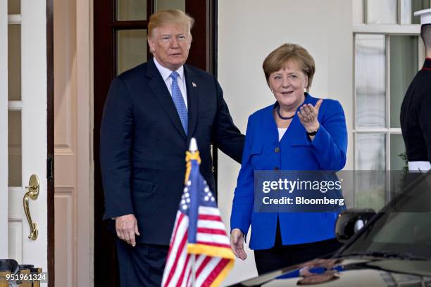 President Donald Trump and Angela Merkel, Germany's chancellor, right, stand for photographs while arriving to the West Wing of the White House in...