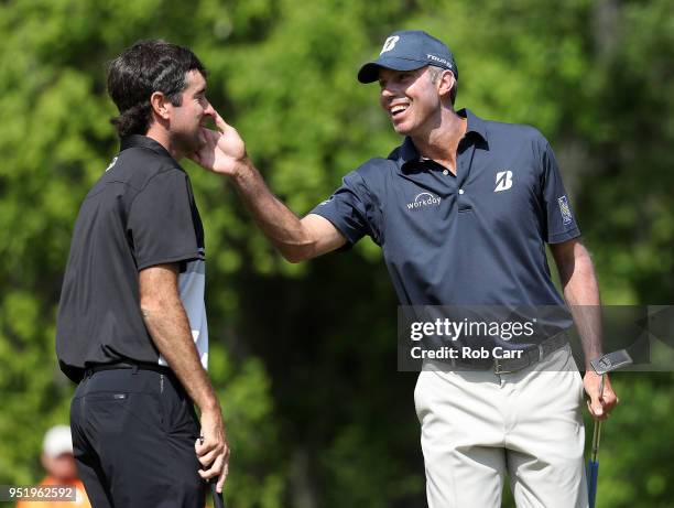 Matt Kuchar reacts to their birdie putt with Bubba Watson on the 15th hole during the second round of the Zurich Classic at TPC Louisiana on April...