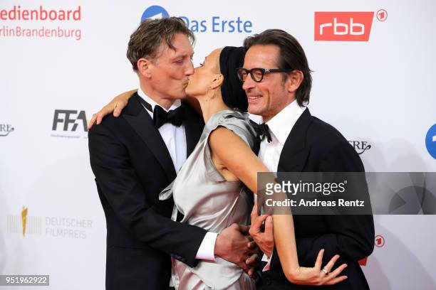 Oliver Masucci, Oskar Roehler and Katja Riemann attend the Lola - German Film Award red carpet at Messe Berlin on April 27, 2018 in Berlin, Germany.