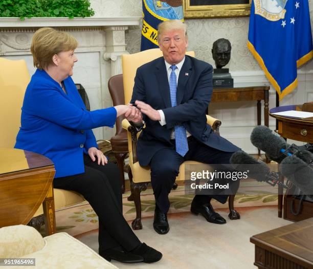 President Donald Trump and German Chancellor Angela Merkel meet in the Oval Office of the White House on April 27, 2018 in Washington, DC. President...