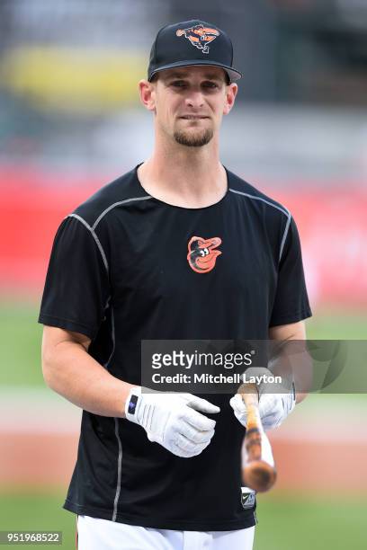 Caleb Joseph of the Baltimore Orioles looks on during batting practice of a baseball game against the Cleveland Indians at Oriole Park at Camden...