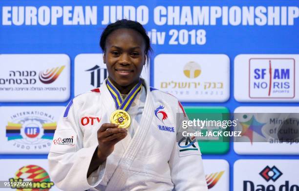 France's gold medallist Clarisse Agbegnenou poses on the podium with her medal after the women's under 63 kilograms weight category competition...