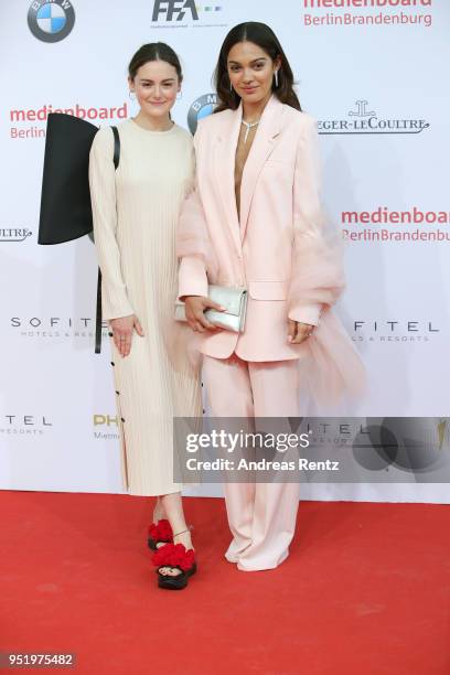 Lea van Acken and Nilam Farooq attend the Lola - German Film Award red carpet at Messe Berlin on April 27, 2018 in Berlin, Germany.