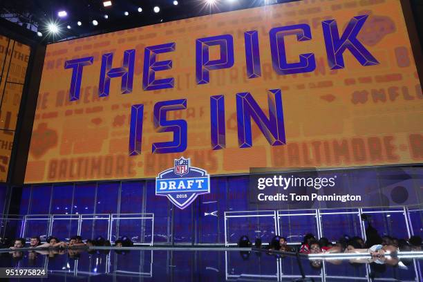 Video board displays the text "THE PICK IS IN" for the Baltimore Ravens during the first round of the 2018 NFL Draft at AT&T Stadium on April 26,...