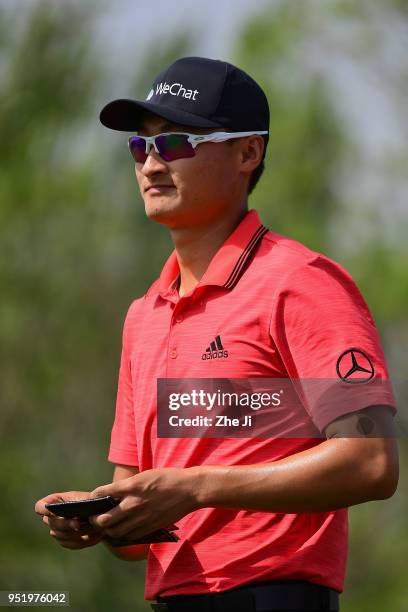 Li Haotong of China looks on during the day two of the 2018 Volvo China Open at Topwin Golf and Country Club on April 27, 2018 in Beijing, China.