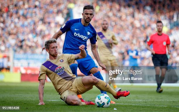 Sebastian Hertner of Aue challenges Lukas Hinterseer of Bochum during the Second Bundesliga match between VfL Bochum 1848 and FC Erzgebirge Aue at...