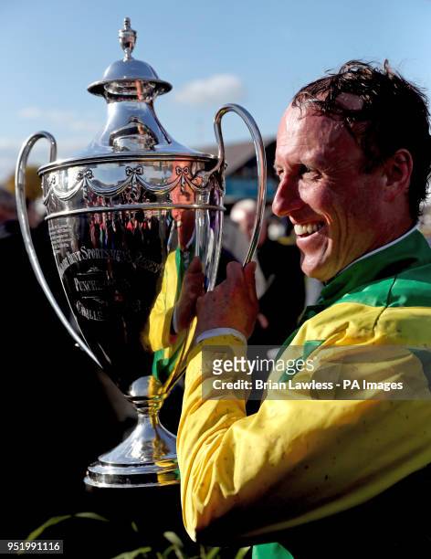 Jockey Robbie Power celebrates with the trophy after winning the BETDAQ 2\% Commission Punchestown Champion Hurdle onboard Supasundae during day four...