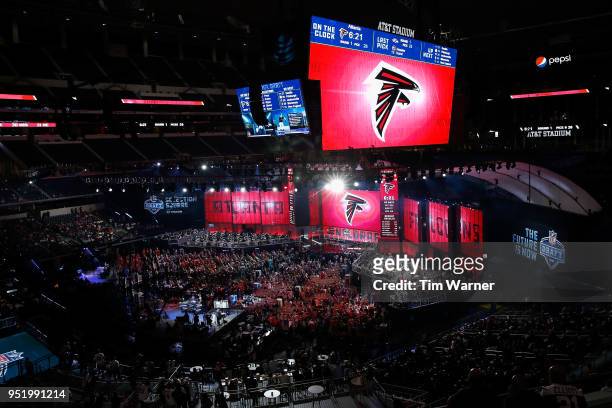 The Atlanta Falcons logo is seen on a video board during the first round of the 2018 NFL Draft at AT&T Stadium on April 26, 2018 in Arlington, Texas.