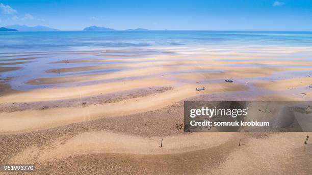 sea beach when ebb tide around the island - ebb tide stock pictures, royalty-free photos & images