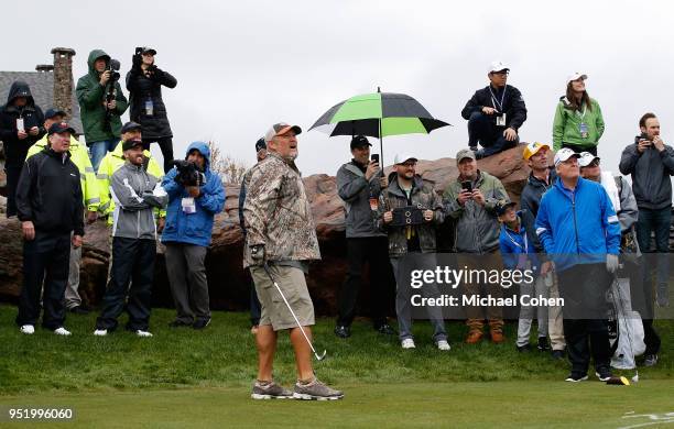 Larry the Cable Guy watches his tee shot as partner Johnny Miller looks on during the Bass Pro Shops Legends of Golf Celebrity Shootout at Big Cedar...