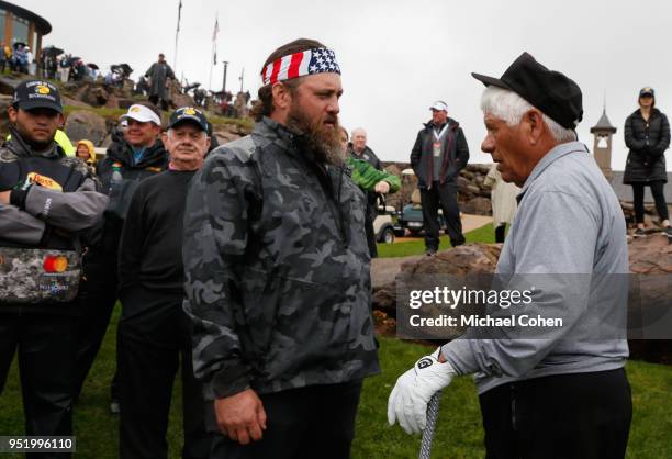 Willie Robertson speaks with Lee Trevino as David Graham looks on during the Bass Pro Shops Legends of Golf Celebrity Shootout at Big Cedar Lodge...