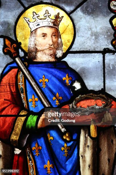 Saint Fargeau church. Stained glass window. Louis IX of France with crown of thorns. France.