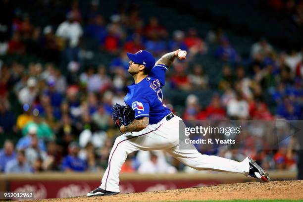Matt Bush of the Texas Rangers throws in the seventh inning against the Oakland Athletics at Globe Life Park in Arlington on April 24, 2018 in...