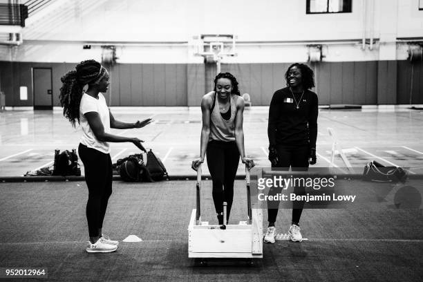 Members of Nigeria's bobsled team train for the 2018 Winter Olympics in Houston, Texas on December 12, 2012. Seun Adigun, Ngozi Onwumere, and Akuoma...