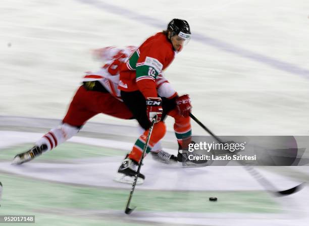 Tomasz Malasinski of Poland challenge Gergo Nagy of Hungary during the 2018 IIHF Ice Hockey World Championship Division I Group A match between...