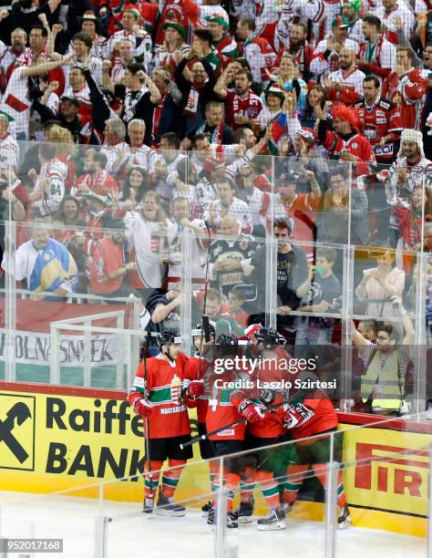 Unidentified teammates of Hungary celebrate the first goal during the 2018 IIHF Ice Hockey World Championship Division I Group A match between Poland...