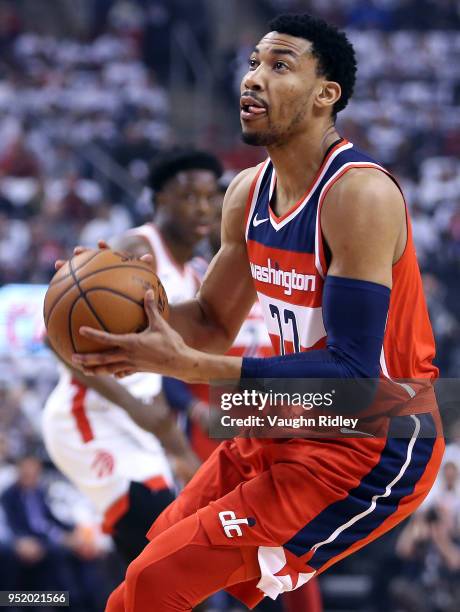 Otto Porter Jr. #22 of the Washington Wizards dribbles the ball during the first half of Game Five against the Toronto Raptors in Round One of the...