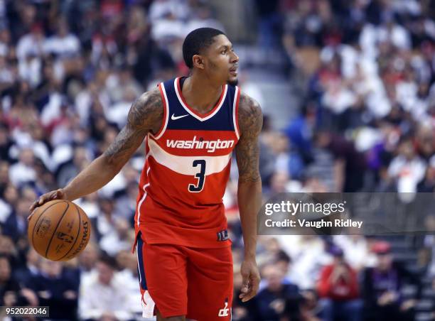 Bradley Beal of the Washington Wizards dribbles the ball during the first half of Game Five against the Toronto Raptors in Round One of the 2018 NBA...