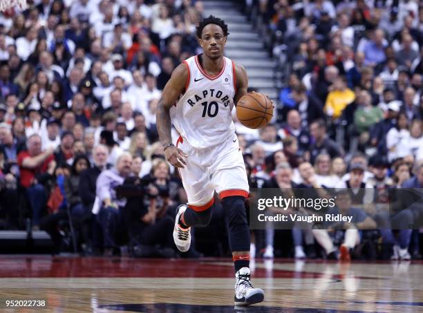 DeMar DeRozan of the Toronto Raptors dribbles the ball during the second half of Game Five against the Washington Wizards in Round One of the 2018...