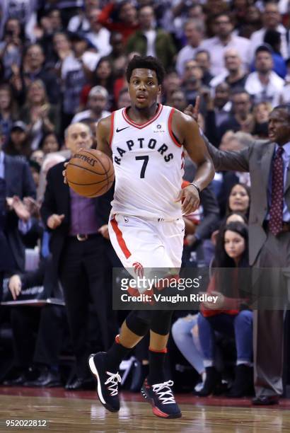 Kyle Lowry of the Toronto Raptors dribbles the ball during the second half of Game Five against the Washington Wizards in Round One of the 2018 NBA...