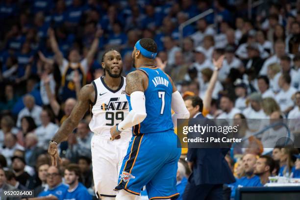 Jae Crowder of the Utah Jazz and Carmelo Anthony of the Oklahoma City Thunder gesture during game 5 of the Western Conference playoffs at the...