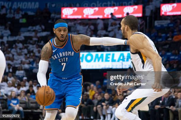 Carmelo Anthony of the Oklahoma City Thunder pushes Rudy Gobert of the Utah Jazz during game 5 of the Western Conference playoffs at the Chesapeake...