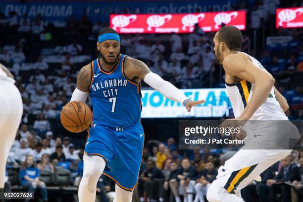 Carmelo Anthony of the Oklahoma City Thunder pushes Rudy Gobert of the Utah Jazz during game 5 of the Western Conference playoffs at the Chesapeake...