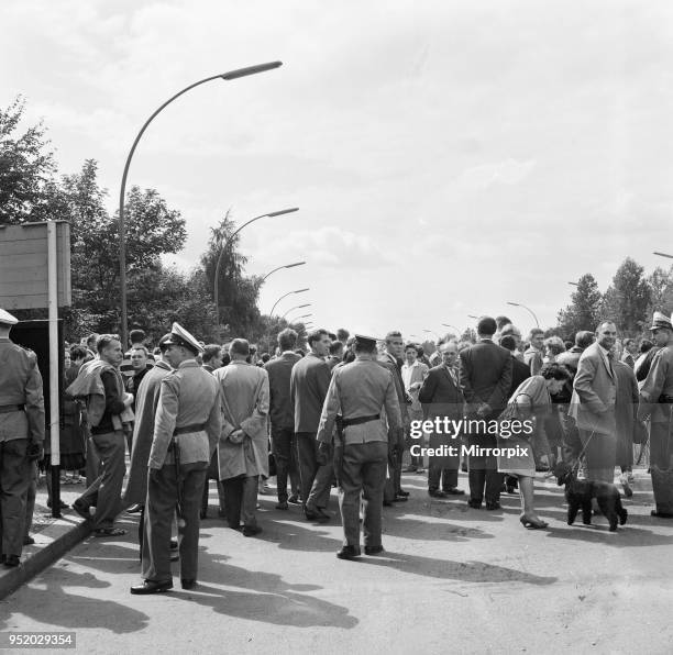 Start of the construction of the Berlin Wall. At midnight on 13th August the police and units of the East German army began to close the border and,...