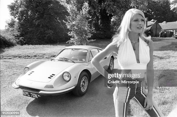 Reveille model Heidi seen here posing with a Ferrari Dino GT which is NOT A top prize in the Reveille win a car competition circa 1972.