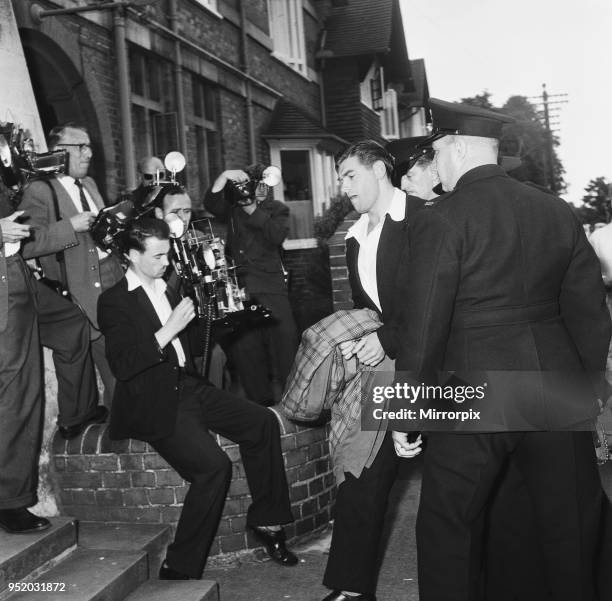 Frank Mitchell, the Mad Axeman, who escaped from Broadmoor Prison arrives at Wokingham Police Court charged with robbery and violence. He was further...