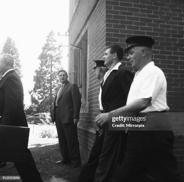 Frank Mitchell, the Mad Axeman, who escaped from Broadmoor Prison is led away from Hartley Wintney police station after being recaptured on a London...